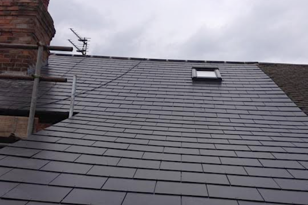 Composite Slate and Velux window on small terrace roof